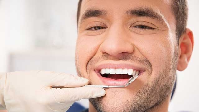 Man oral hygiene check up
